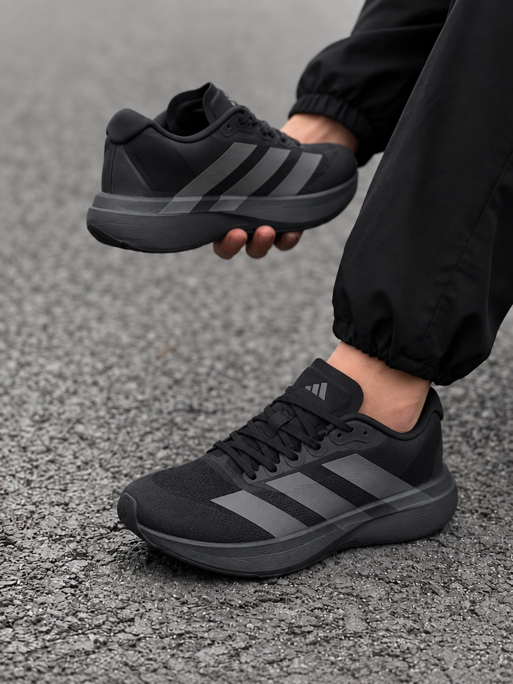 Black Adidas running shoes
