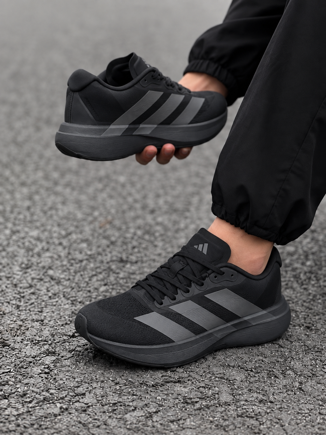 Black Adidas running shoes