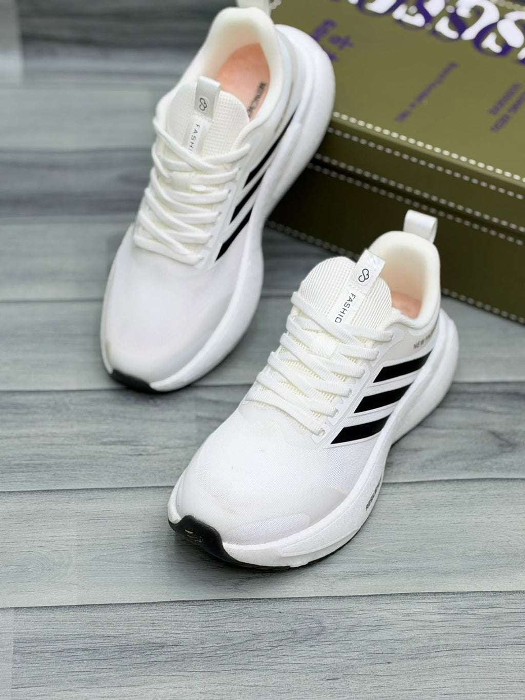 White Gossgeke chunky sneakers with black stripes and cushioned sole, front view