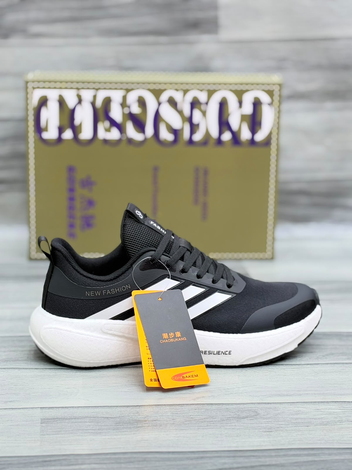 Black Gossgeke chunky sneakers with white three-stripe design and thick white sole, top-angle view