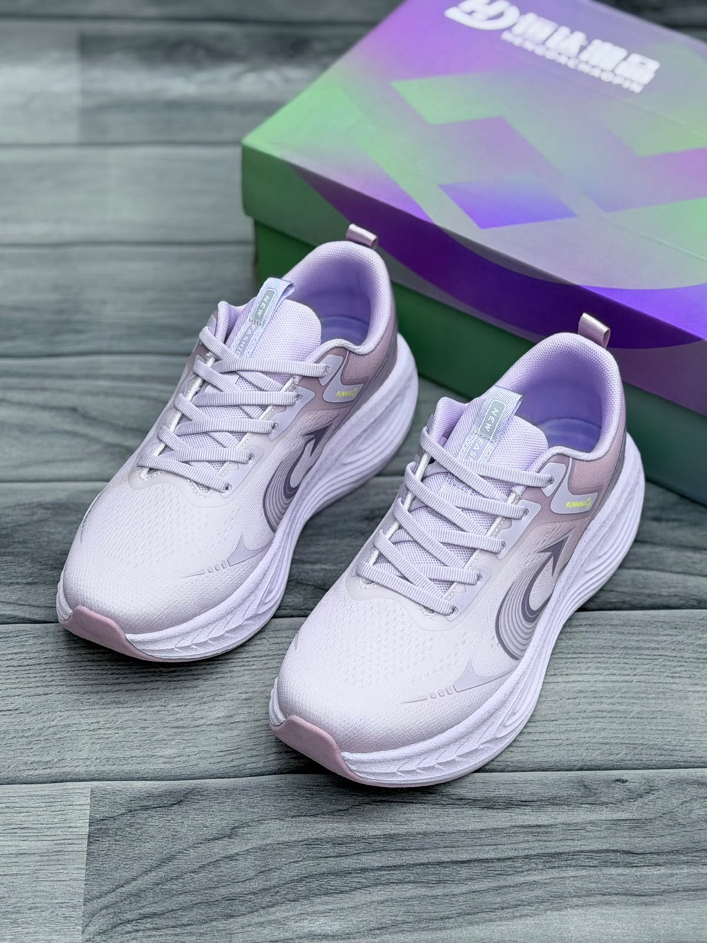 Women’s white and lavender lightweight sports shoes for running and training