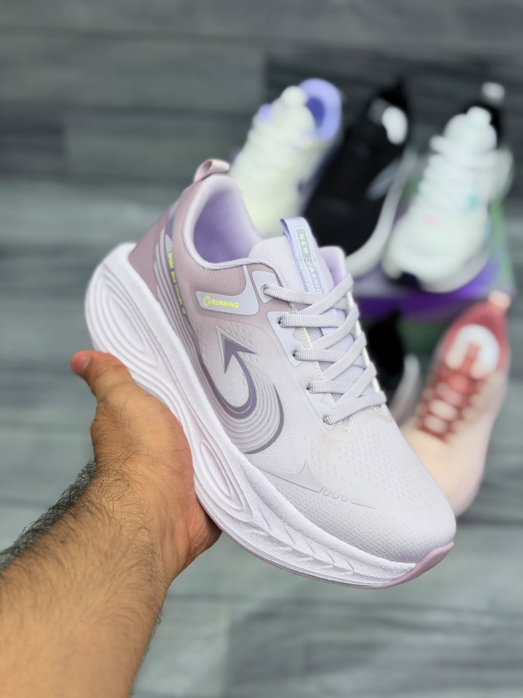 Women’s white and lavender lightweight sports shoes for running and training