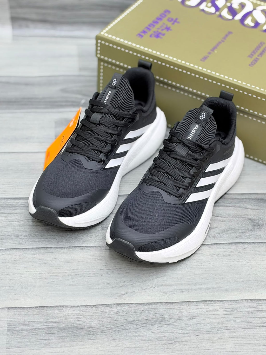 Black Gossgeke chunky sneakers with white three-stripe design and thick white sole, top-angle view