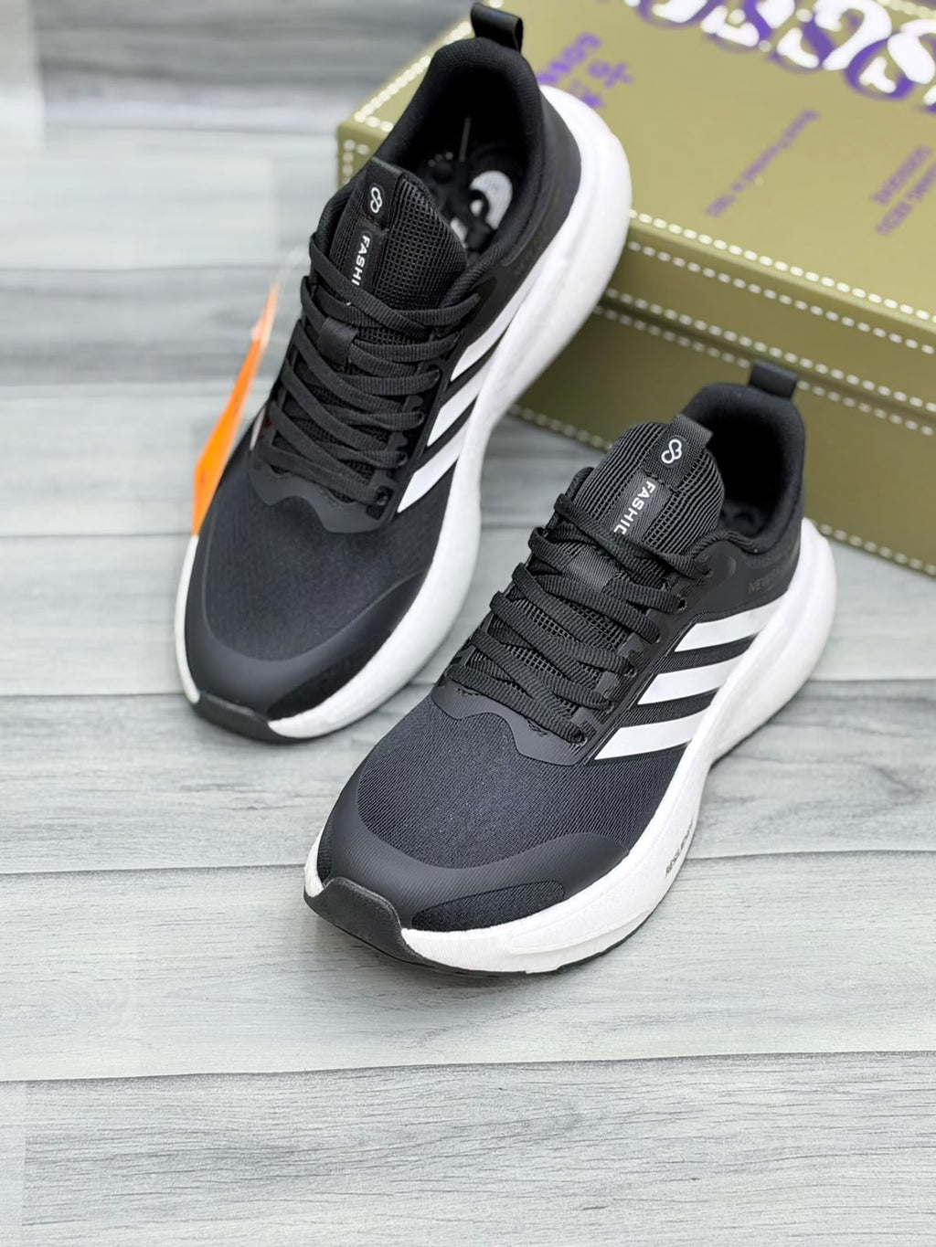 Black Gossgeke chunky sneakers with white three-stripe design and thick white sole, top-angle view