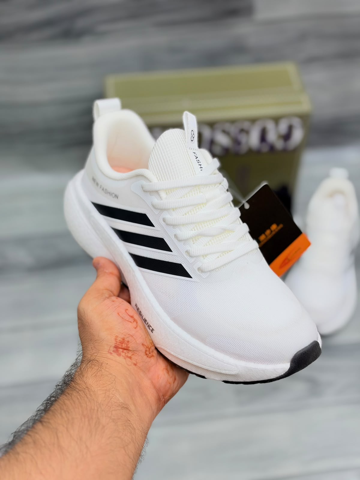 White Gossgeke chunky sneakers with black stripes and cushioned sole, front view
